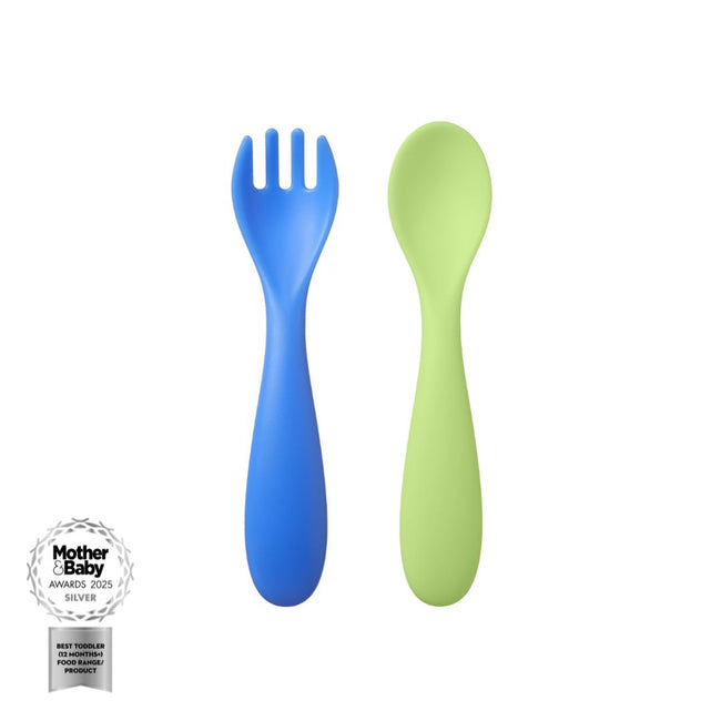A Nuby Baby Weaning Cutlery 6 Pack blue spork and green spoon are shown side by side on a white background, with a Silver Mother & Baby Awards 2025 badge in the bottom left corner.
