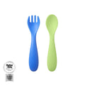 A Nuby Baby Weaning Cutlery 6 Pack blue spork and green spoon are shown side by side on a white background, with a Silver Mother & Baby Awards 2025 badge in the bottom left corner.