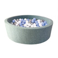 The Nuby Baby Ball Pit is a round, light-green play area for kids, filled with 200 blue and white balls, shown against a plain white background.