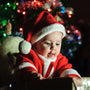 Baby dressed as Santa on first Christmas