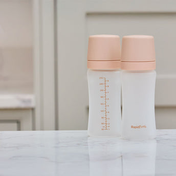 The Nuby RapidBottle sat on a kitchen counter top in the beige colourway.