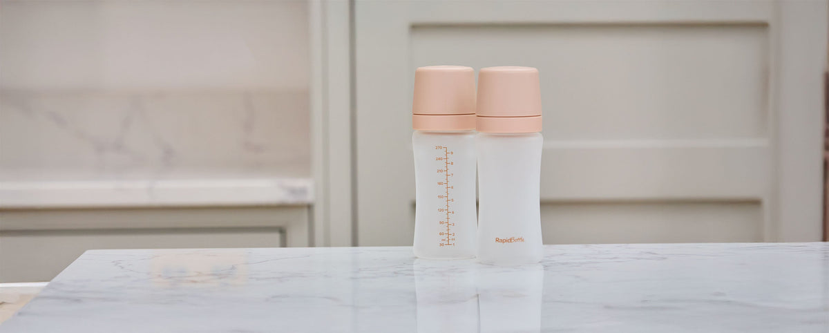 The Nuby RapidBottle sat on a kitchen counter top in the beige colourway.