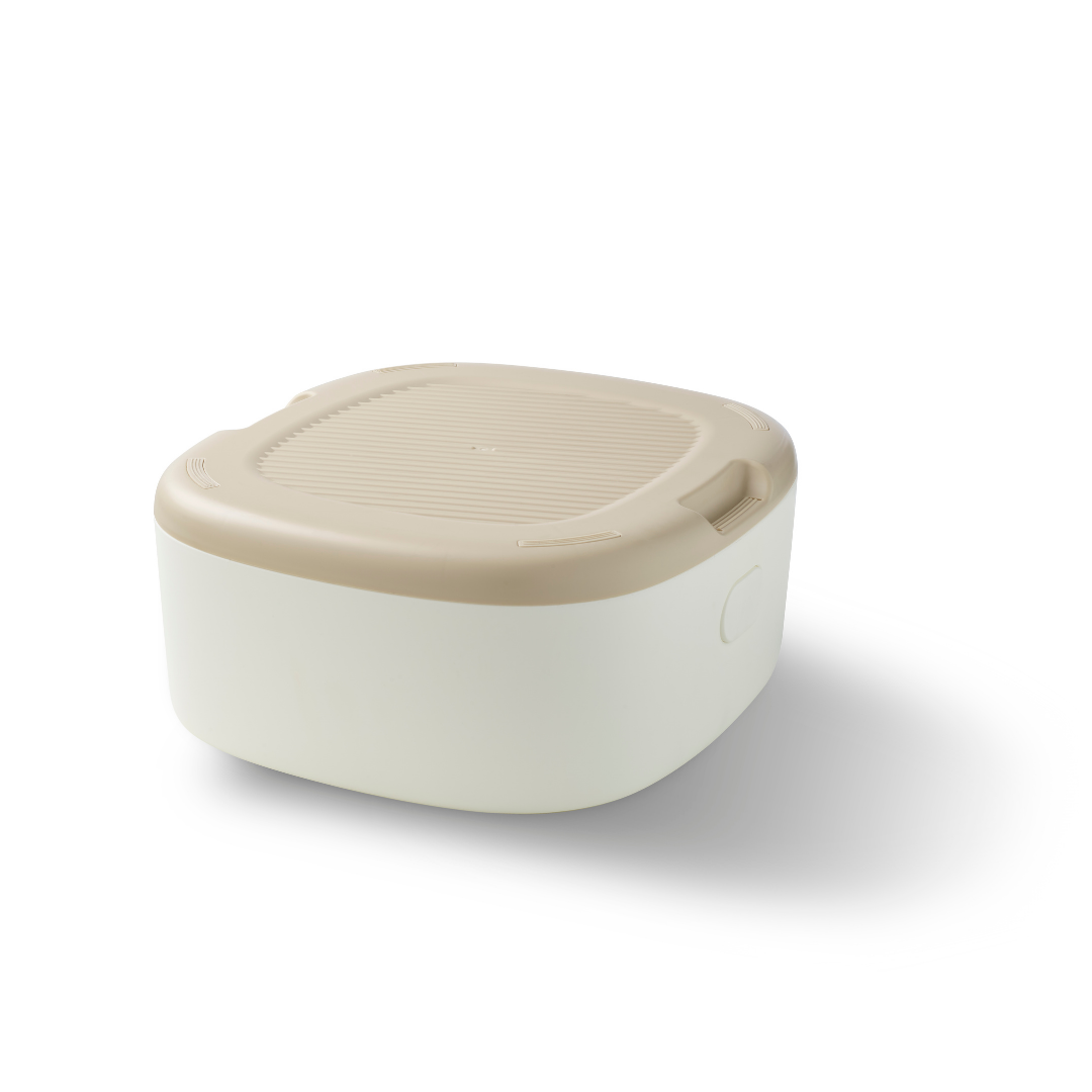 The Gro Up 3 in 1 Potty, a beige and white rectangular plastic container with a rounded lid, is designed for effective potty training and is shown on a white background.