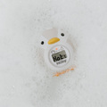 The Nuby UK Sit Me Up Bath & Thermometer Bundle includes a duck-shaped baby bath thermometer that floats and displays Hot on its digital screen for safe bathing.