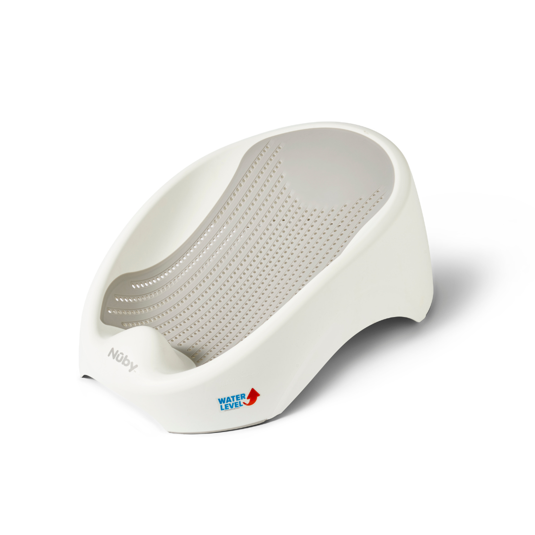 The Newborn Baby Bath Support is made of white plastic and features a perforated, contoured surface for comfort. It includes a small maximum water level indicator label with a red arrow on the lower side. Lightweight and ergonomically designed, it also comes with a cushioned back rest to provide added comfort for newborns during bath time.