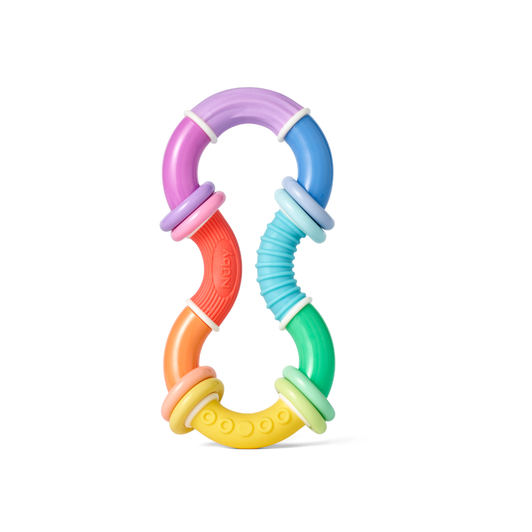 The Twista Rattle Teether is a colorful baby teething toy shaped like an hourglass, featuring sections of purple, blue, green, yellow, orange, and red with varied textures and four round rings for soothing teething relief. This sensory toy is designed to keep little hands engaged while providing comfort as a gentle baby teether.