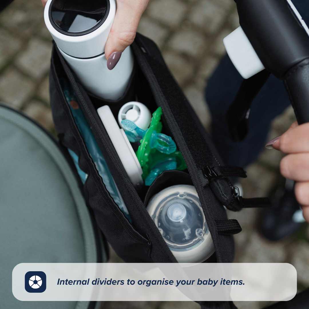 A close-up of the Nuby Pram Organiser Bag shows internal dividers neatly holding a bottle, pacifiers, a white thermos, and baby essentials as hands adjust the bag. Text overlay: Internal dividers to organise your baby items.