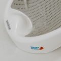 A close-up of the Nuby Newborn Baby Bath Support in white and gray shows water pouring on it. A red arrow marks the max water level on the side, ensuring safe use during your babys bath.