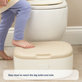 A child’s bare foot steps onto the beige and white Gro Up 3 in 1 Potty step stool in front of a toilet. The caption says, Gro Up 3 in 1 Potty step stool for potty training to help little ones reach the big toilet and sink.