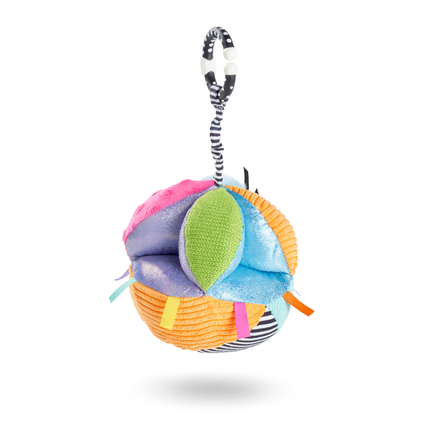 The Things with Wings Sensory Grab Ball features textured fabrics and ribbon tags; this plush pram toy hangs from a black-and-white striped loop and is shown against a white background.
