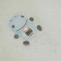 The Nuby Hippo Bath & Room Thermometer, in a cute blue hippo shape, floats in bubbly water as its clear digital display shows a temperature of 39.5°C.