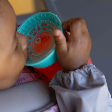 The all around beaker by Nuby in a red and aqua colourway.