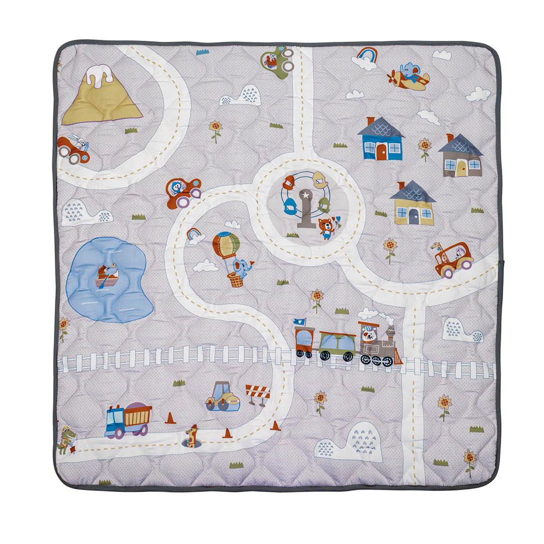The Quilted Playmat features colorful winding roads, cars, a train, houses, trees, animals, a pond, mountains, and a hot air balloon on a gray background—perfect for tummy time and little explorers.