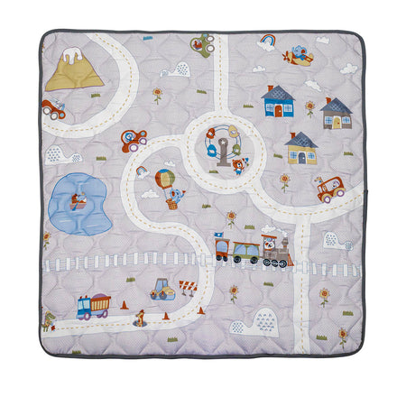 The Quilted Playmat features colorful winding roads, cars, a train, houses, trees, animals, a pond, mountains, and a hot air balloon on a gray background—perfect for tummy time and little explorers.
