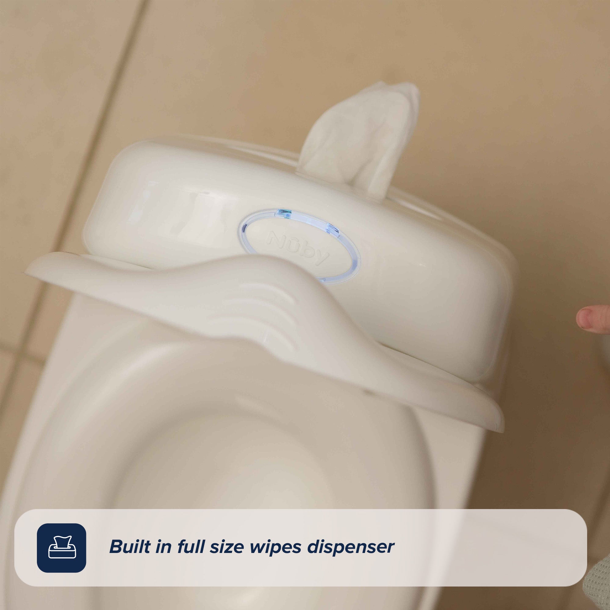 A My Real Mini Toilet Potty features a built-in full-size white wipes dispenser on top, with a tissue sticking out.