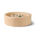 A close up image of a ball pit in a beige colourway. This hosts green, white and beige balls inside the children's toy.