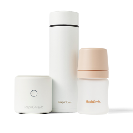The white and beige “Rapid” Bottle Feeding Starter Set, which includes a UV bottle steriliser, baby formula cooler, and baby bottle, is arranged side by side on a white background.