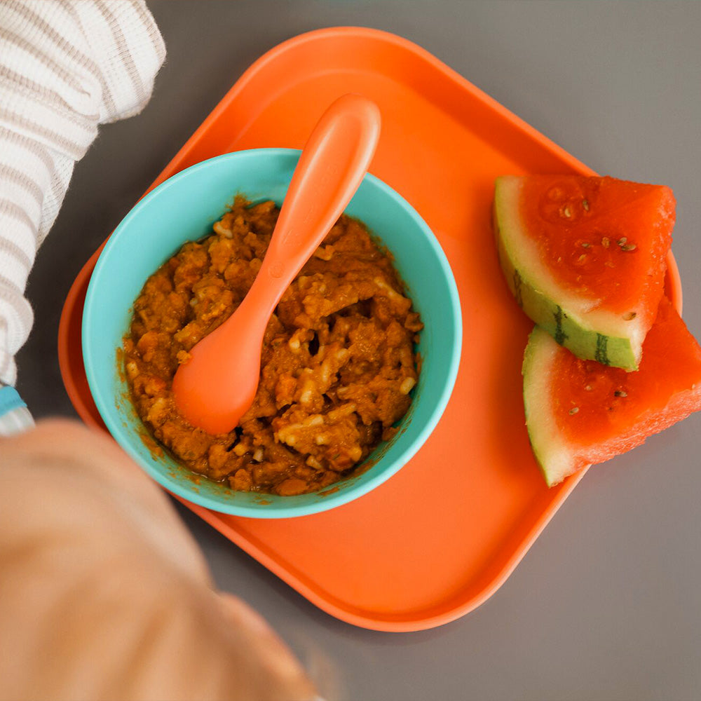 A photograph of a meal on the Nuby Brights tableware including the cutlery.