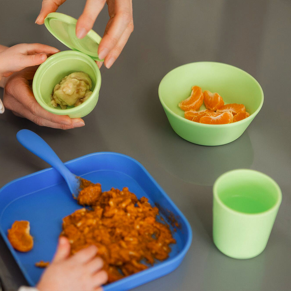 A baby tumbler in green by Nuby, including other Brights tableware.