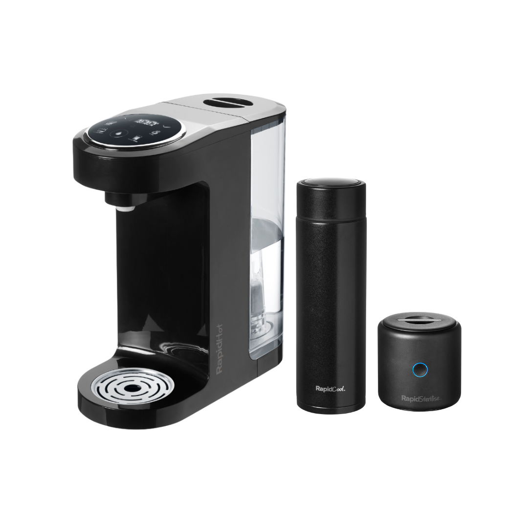 The Nuby UK Formula Making Set is a sleek black single-serve maker with a digital display and rapidcool technology, including a matching travel mug and cylindrical accessory, all shown on a white background.