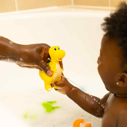 A bright yellow DIno Squirter by Nuby.