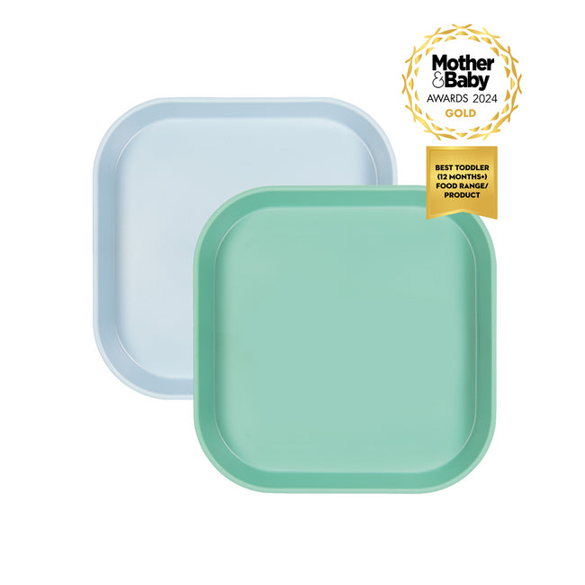 A pair of blue and green plates with a Mother & Baby Awrd 2024 ribbon on a white background. The text on the ribbon says Best Toddler (12 months+) Food Range / Product