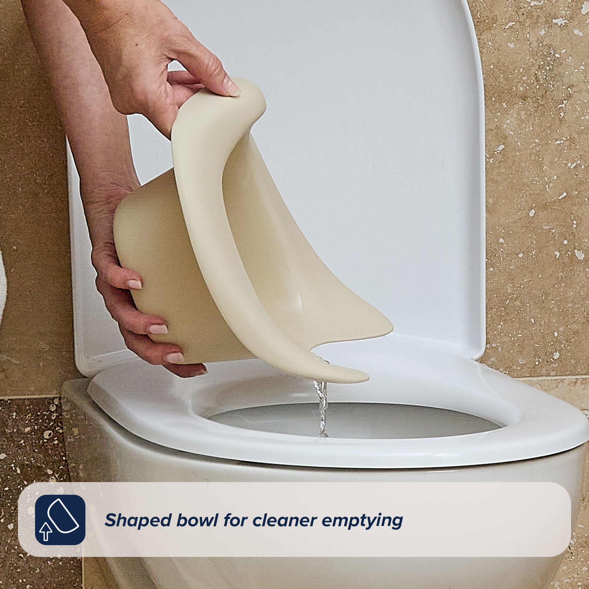 A hand pours liquid from a flexible, beige bowl into a toilet. Text at the bottom reads, Shaped bowl for cleaner emptying—perfect for potty training with the Easy Clean Potty Beige’s removable insert.