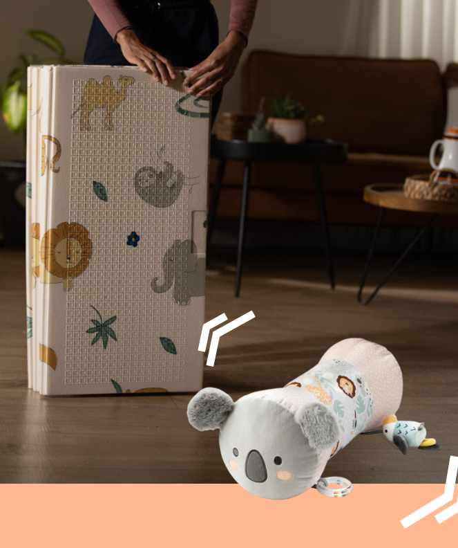 The Tummy Time roller from Animal Adventures sat beside a Safari themed play mat.