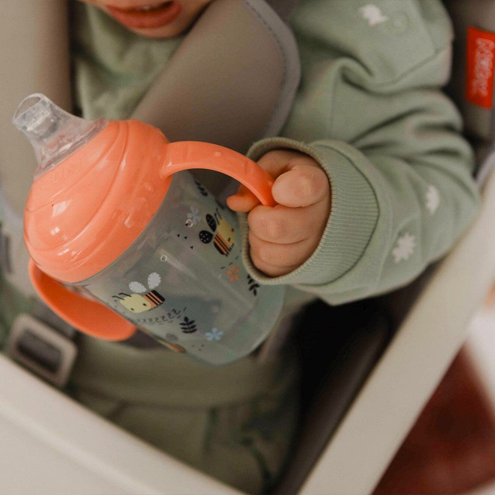 The Grip n Sip cup in a young child's hands.