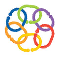Nuby Linkables are six textured plastic rings in blue, green, purple, orange, red, and yellow with raised bumps and rounded ends. These baby toy links easily connect in a circle—ideal for stroller or pram attachment.