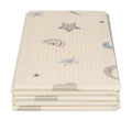 The Nuby Foldable Play Mat, Stars, includes four beige reversible foam mats with simple star, rainbow, and abstract shape illustrations in muted colors.