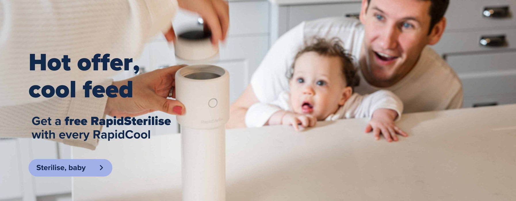 A close up of the RapidCool being used alongside a RapidSterilise. A baby's Father is sat alongside their baby while looking at the Nuby.