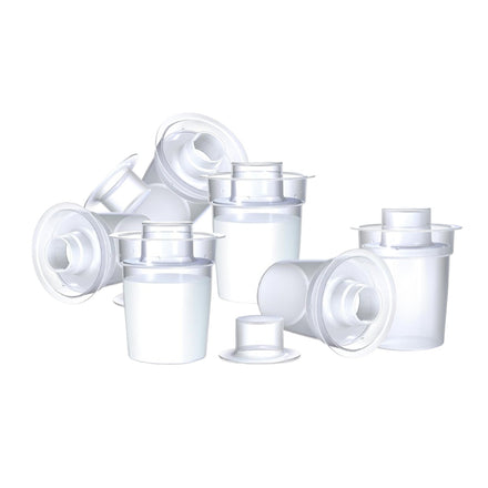 Milk powder dispensers laid out on a white surface created by Nuby.