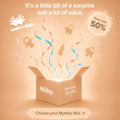 A glowing box labeled Nuby Mystery Box with colorful ribbons and silhouettes of a pacifier, bottle, and teddy bear emerging. Text: It's a fun surprise and big value—save over 50%. Choose your Nuby Mystery Box!.