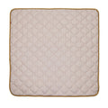 The Quilted Playmat is a beige, padded mat with rounded corners and a brown border, featuring a stitched diamond pattern for added comfort.
