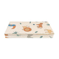 The play mat in safari by Nuby folded up and on a white background.