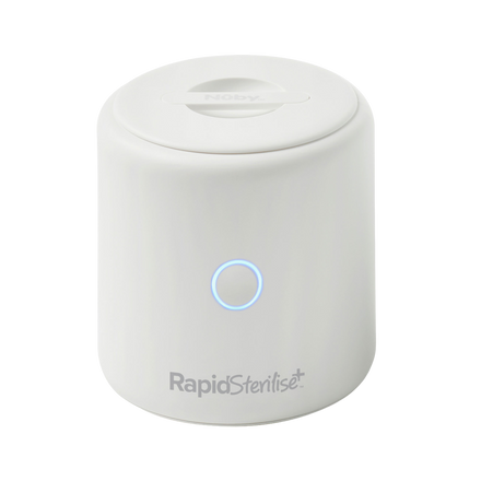 A white, cylindrical Nuby UK RapidSterilise Plus UV Steriliser with a round lid, blue-lit front button, and product name near the bottom.