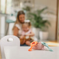 The easy grip spoons by Nuby sat on a table top as part of a young child having a meal by using them.
