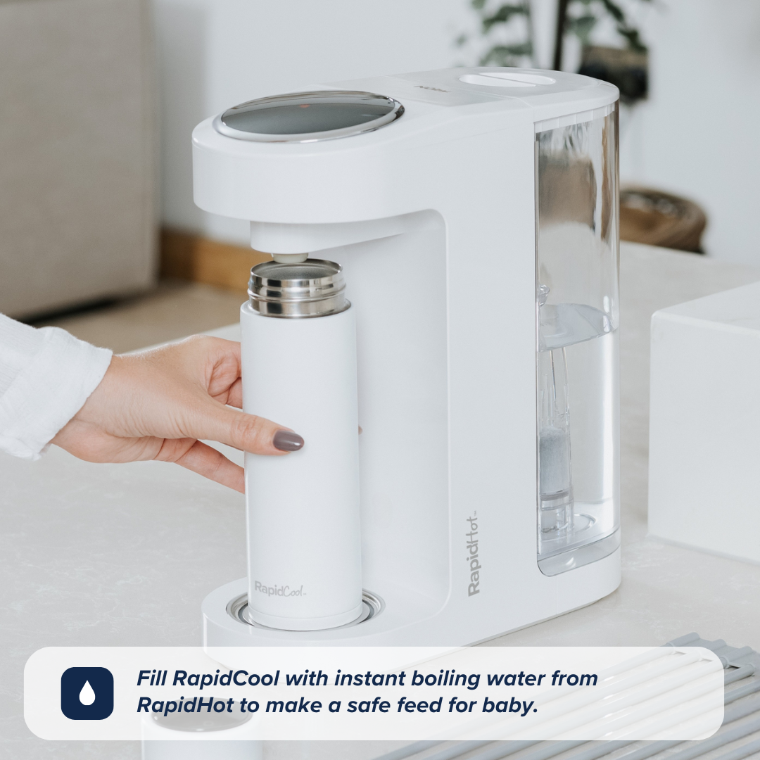 The RapidCool being placed underneath the spot to produce hot water from the RapidHot. This is on a kitchen worktop.