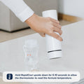 A hand holds a white cylindrical Nuby UK device from the Formula Making and Sterilising Bundle upside down above a baby bottle. The text instructs to hold it upside down for 5-10 seconds to check the formula temperature.