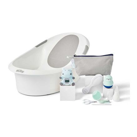 The Baby Bath and Grooming Bundle features a white baby bathtub with a gray insert plus essentials like a zippered pouch, brush, digital thermometer, nail scissors, nasal aspirator, and more baby care items in one kit.
