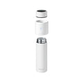 A white, cylindrical RapidSterilise Baby Bottle Maker Steriliser by Nuby UK is shown with its lid removed and separated into two parts, resembling a baby bottle steriliser, displayed upright against a plain background.