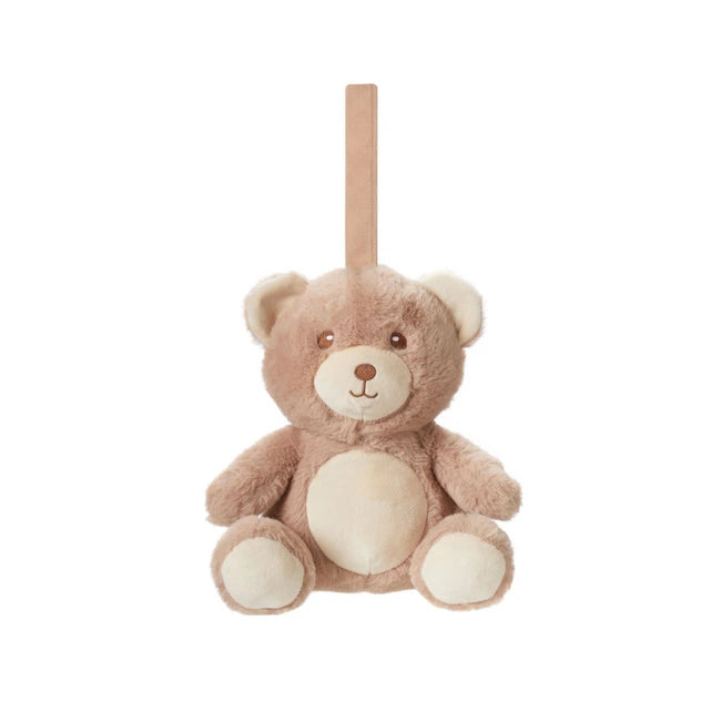 The Nuby UK Biscuit Bear Baby Sleep Aid with Cry Sensor is a light brown plush teddy bear with a beige snout, belly, stitched smile, round eyes, and an attached beige strap. It features a built-in white noise function. Background is plain white.