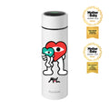 The Limited Edition Nuby RapidCool x Mul bottle features a cartoon character with a big red heart-shaped head holding a teal heart and displays a 2025 Mother & Baby Awards Gold badge, as well as an award for the Best Travel Product Over £30 from Mother&Baby in 2026. Perfect for formula feeding moments.