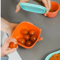 Cherry tomatoes in nesting food containers for children