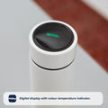 The Nuby RapidCool™ Baby Bottle Maker Twin Pack features white bottles with circular digital displays showing the Nuby logo. The colour temperature indicator makes it ideal for travel bottle feeding.