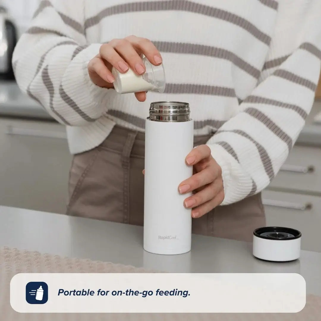 A person in a striped sweater pours milk from a small glass jar into the limited edition RapidCool x Mul baby bottle by Nuby on a kitchen counter. The text reads, Portable for on-the-go feeding.