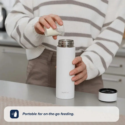 A person in a striped sweater pours milk from a small glass jar into the limited edition RapidCool x Mul baby bottle by Nuby on a kitchen counter. The text reads, Portable for on-the-go feeding.