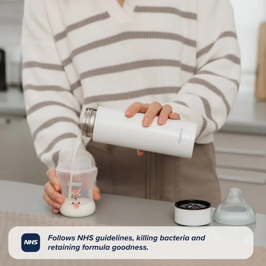 A person in a striped sweater pours liquid from a white Nuby RapidCool x Mul thermos into a baby bottle on a kitchen counter. Text reads: Follows NHS guidelines, kills bacteria, and retains formula goodness.