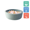 The Nuby Ball Pit for Babies is a round, light gray pit filled with 200 pink, white, and gold balls. Made of super soft material, it supports fine motor skill development—perfect for your little one’s playtime.